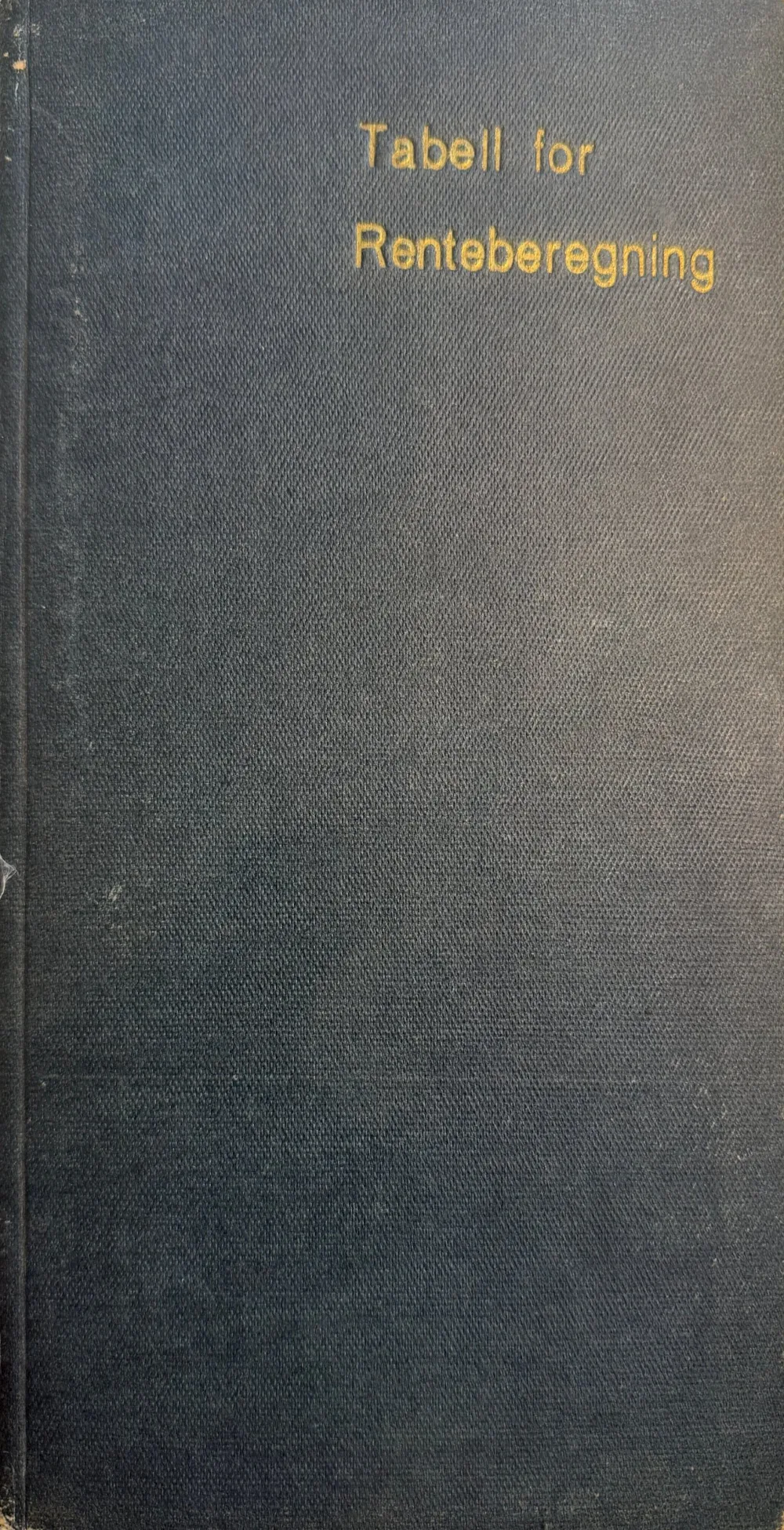 Tabell for Renteberegning – mørkeblå perm med gullskrift, laget av RTB i 1944